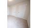 A spacious bedroom features neutral walls, plush carpeting, and several white doors at 458 Bishop Ln, Woodstock, GA 30188