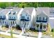 Charming two-story homes featuring inviting front porches, white picket fences, and beautifully landscaped front yards at 458 Bishop Ln, Woodstock, GA 30188