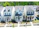 Charming two-story homes featuring inviting front porches, white picket fences, and beautifully landscaped front yards at 458 Bishop Ln, Woodstock, GA 30188