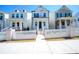 Charming two-story home with white picket fence and inviting front porch, and landscaped yard at 458 Bishop Ln, Woodstock, GA 30188