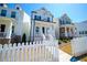 Charming two-story home with white picket fence and inviting front porch, with dark shutters at 458 Bishop Ln, Woodstock, GA 30188