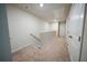 Carpeted hallway with neutral walls, white trim, and white doors; a bright, transitional space at 458 Bishop Ln, Woodstock, GA 30188