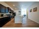 Spacious kitchen features dark cabinets, stainless steel appliances, and a large kitchen island at 458 Bishop Ln, Woodstock, GA 30188