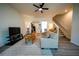 Cozy living room with hardwood floors, modern furniture, and a seamless flow to the kitchen at 458 Bishop Ln, Woodstock, GA 30188
