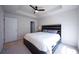 Bright main bedroom with a tray ceiling, ceiling fan, carpet floors and a large window for natural light at 458 Bishop Ln, Woodstock, GA 30188