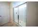 Modern bathroom featuring a glass enclosed shower with tile surround and a built-in niche at 458 Bishop Ln, Woodstock, GA 30188