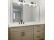 Stylish bathroom featuring a double vanity with a large mirror and modern fixtures at 609 Pinetree Dr, Decatur, GA 30030