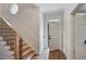 Bright entryway with hardwood floors, staircase, and white paneled doors at 609 Pinetree Dr, Decatur, GA 30030