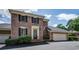 Charming brick home with black shutters, elegant entrance, and attached two-car garage at 609 Pinetree Dr, Decatur, GA 30030