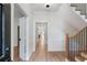 Inviting hallway with hardwood floors, staircase, and white trim details at 609 Pinetree Dr, Decatur, GA 30030