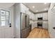 Updated kitchen with stainless steel appliances, white cabinetry, and hardwood floors at 609 Pinetree Dr, Decatur, GA 30030