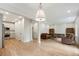 Inviting living space with hardwood floors, an open layout, and a modern kitchen with stainless steel appliances at 609 Pinetree Dr, Decatur, GA 30030