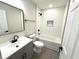 Bathroom featuring a shower-tub combo, new fixtures, and stylish vanity at 6205 Hudson Nw St, Covington, GA 30014