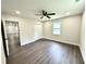 Spacious bedroom with a ceiling fan, and a bright window at 6205 Hudson Nw St, Covington, GA 30014