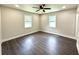 Bedroom featuring a ceiling fan and ample natural light from dual windows at 6205 Hudson Nw St, Covington, GA 30014
