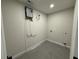 Utility room featuring modern equipment and neutral tones at 6205 Hudson Nw St, Covington, GA 30014