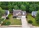 Aerial view of a two-story home with a well-manicured lawn, brick and siding exterior, and a two-car garage at 2086 Grant Ave, Mcdonough, GA 30252