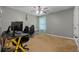 Bedroom featuring a gaming desk, two chairs, carpet, and natural light at 2086 Grant Ave, Mcdonough, GA 30252