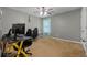 Bedroom with a gaming setup, including a computer, desk, and chairs at 2086 Grant Ave, Mcdonough, GA 30252