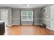 Open-concept dining area with hardwood floors and ample natural light at 2086 Grant Ave, Mcdonough, GA 30252