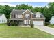 Charming two-story home with well-maintained lawn and attached two-car garage at 2086 Grant Ave, Mcdonough, GA 30252