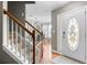 Welcoming foyer with hardwood floors and staircase leading to the upper level at 2086 Grant Ave, Mcdonough, GA 30252