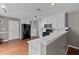 Bright kitchen featuring white cabinets, modern appliances, and hardwood floors at 2086 Grant Ave, Mcdonough, GA 30252