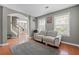 Comfortable living room with hardwood floors, large windows, and neutral gray paint at 2086 Grant Ave, Mcdonough, GA 30252