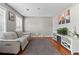 Bright living room featuring hardwood floors, neutral walls, and modern decor with an aquarium at 2086 Grant Ave, Mcdonough, GA 30252