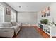 Relaxing living room with modern decor and warm hardwood floors at 2086 Grant Ave, Mcdonough, GA 30252