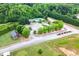 Aerial view of the neighborhood community pool and clubhouse surrounded by mature trees at 2086 Grant Ave, Mcdonough, GA 30252