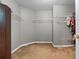 Spacious walk-in closet with ample shelving and carpeted floors at 2086 Grant Ave, Mcdonough, GA 30252