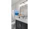 Modern bathroom features a gray vanity, stylish lighting and elegant finishes at 437 E Ontario Sw Ave, Atlanta, GA 30310