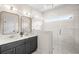 Luxurious bathroom features a double vanity, glass enclosed shower and marble countertops at 437 E Ontario Sw Ave, Atlanta, GA 30310