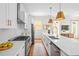 Modern kitchen with stainless steel appliances, white cabinets, and an eat-in island at 437 E Ontario Sw Ave, Atlanta, GA 30310