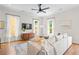 Bright living room with hardwood floors, large windows, ceiling fan and neutral decor at 437 E Ontario Sw Ave, Atlanta, GA 30310