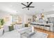 Open-concept living room and kitchen with stainless steel appliances and modern finishes at 437 E Ontario Sw Ave, Atlanta, GA 30310