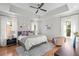 Bright main bedroom with tray ceilings, hardwood floors and large windows at 437 E Ontario Sw Ave, Atlanta, GA 30310
