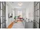 Stylish home office with hardwood floors, natural light, and comfortable seating at 437 E Ontario Sw Ave, Atlanta, GA 30310