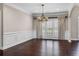 Elegant dining room features hardwood floors, crown molding, and bright windows with plantation shutters at 4769 Ellington Ct, Marietta, GA 30067