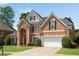 Gorgeous brick home features a well-maintained lawn, two-car garage, and classic black shutters, radiating curb appeal at 4769 Ellington Ct, Marietta, GA 30067