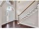 Bright foyer with hardwood floors, a staircase, and an arched window over front door, adding architectural charm at 4769 Ellington Ct, Marietta, GA 30067