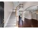 Elegant foyer showcasing staircase, hardwood floors, and open layout, inviting guests into a bright, spacious home at 4769 Ellington Ct, Marietta, GA 30067