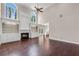 Bright living room with fireplace, built-in shelving, hardwood floors, tall ceilings and expansive arched windows at 4769 Ellington Ct, Marietta, GA 30067