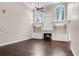 Spacious living room with fireplace, built-in shelving, hardwood floors, tall ceilings, and arched windows at 4769 Ellington Ct, Marietta, GA 30067