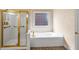 Main bathroom showcasing a glass shower, tub, and tiled floors at 4769 Ellington Ct, Marietta, GA 30067