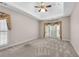 Bright and airy main bedroom with large windows and neutral carpeting at 4769 Ellington Ct, Marietta, GA 30067