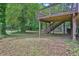 View of the backyard and an elevated wooden deck with access stairs at 5295 Old Trail Cir, Stone Mountain, GA 30088
