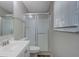 Clean bathroom featuring a shower over tub, window, and updated vanity at 5295 Old Trail Cir, Stone Mountain, GA 30088