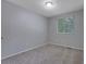 Bedroom with neutral carpet, large window, and ample natural light at 5295 Old Trail Cir, Stone Mountain, GA 30088